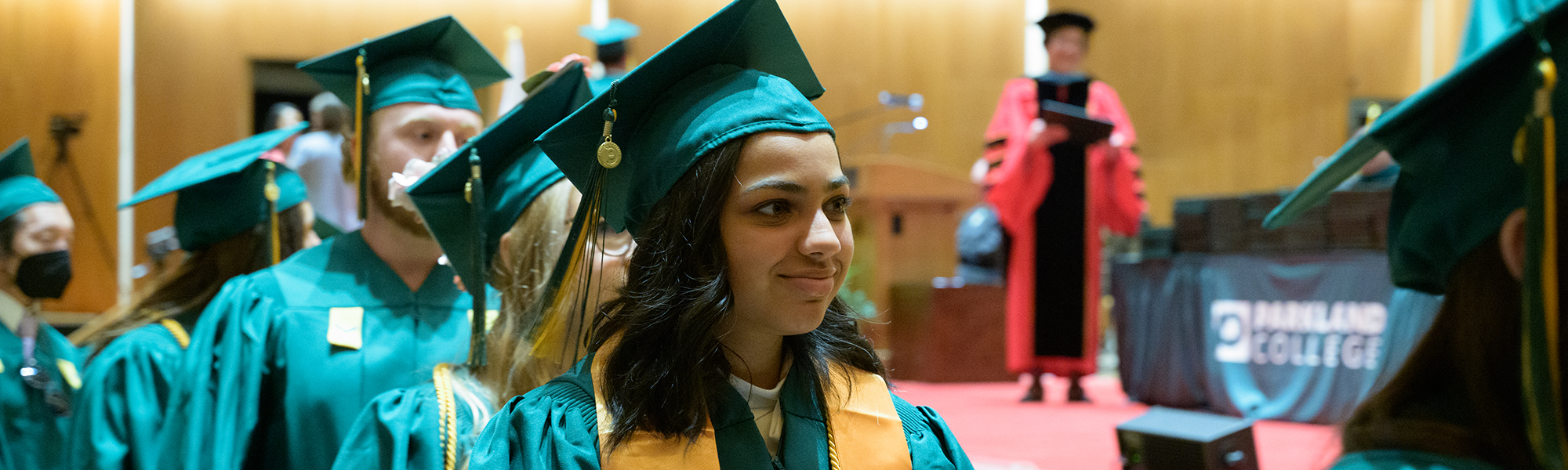 students walking at graduation