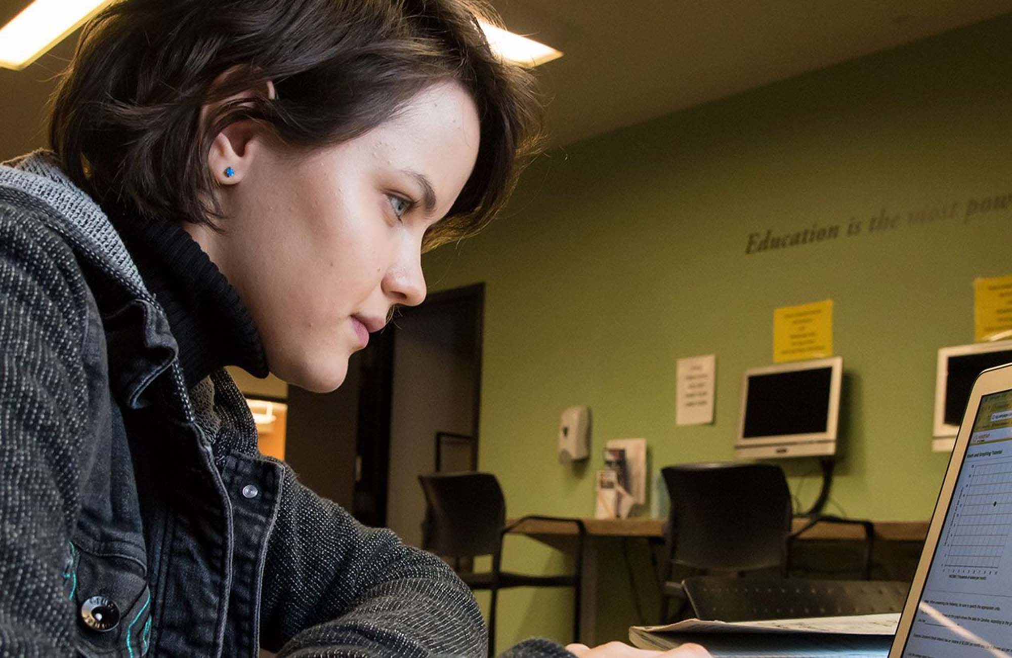 female student looking at computer