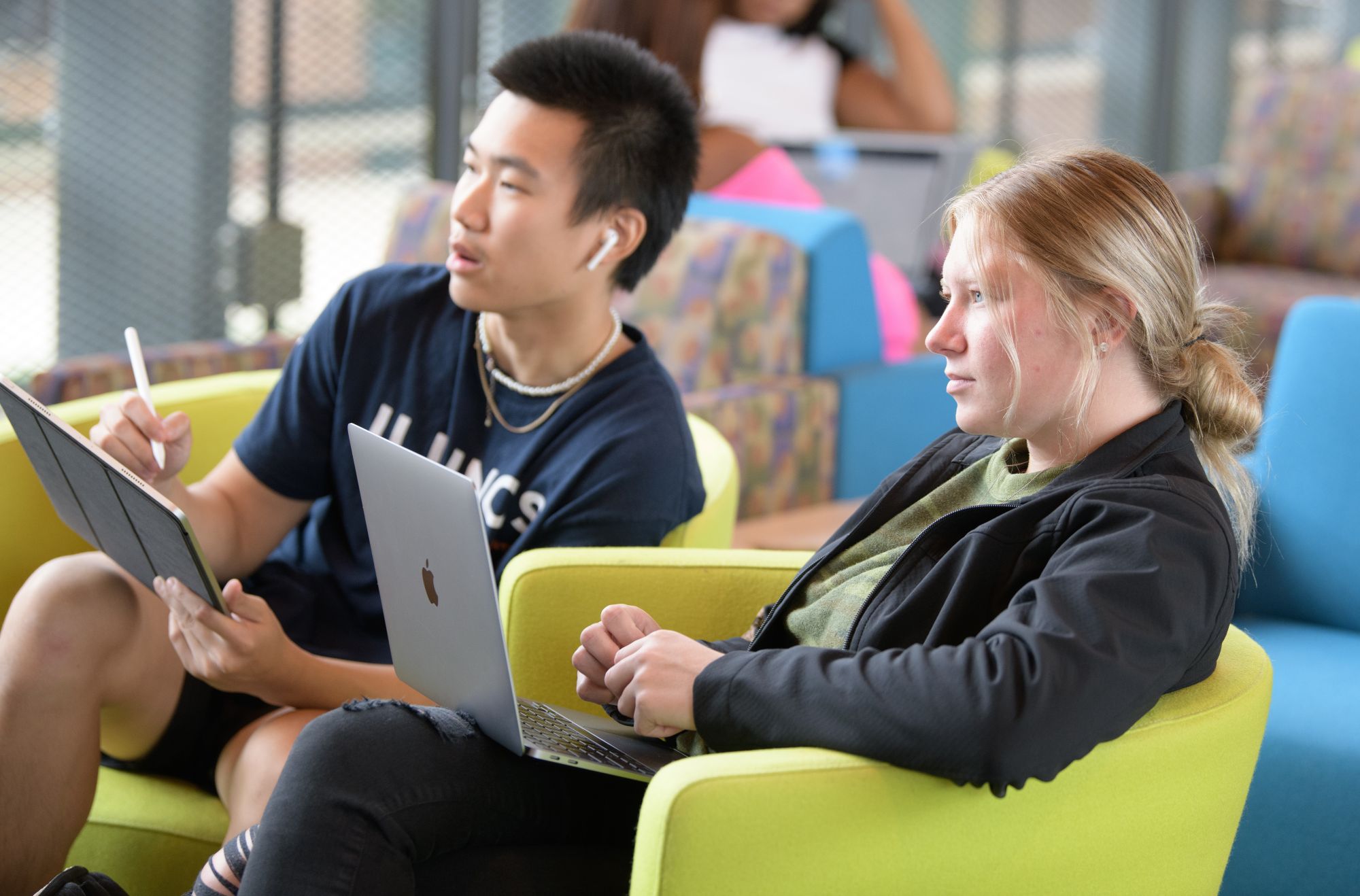 two students studying in the student union. 