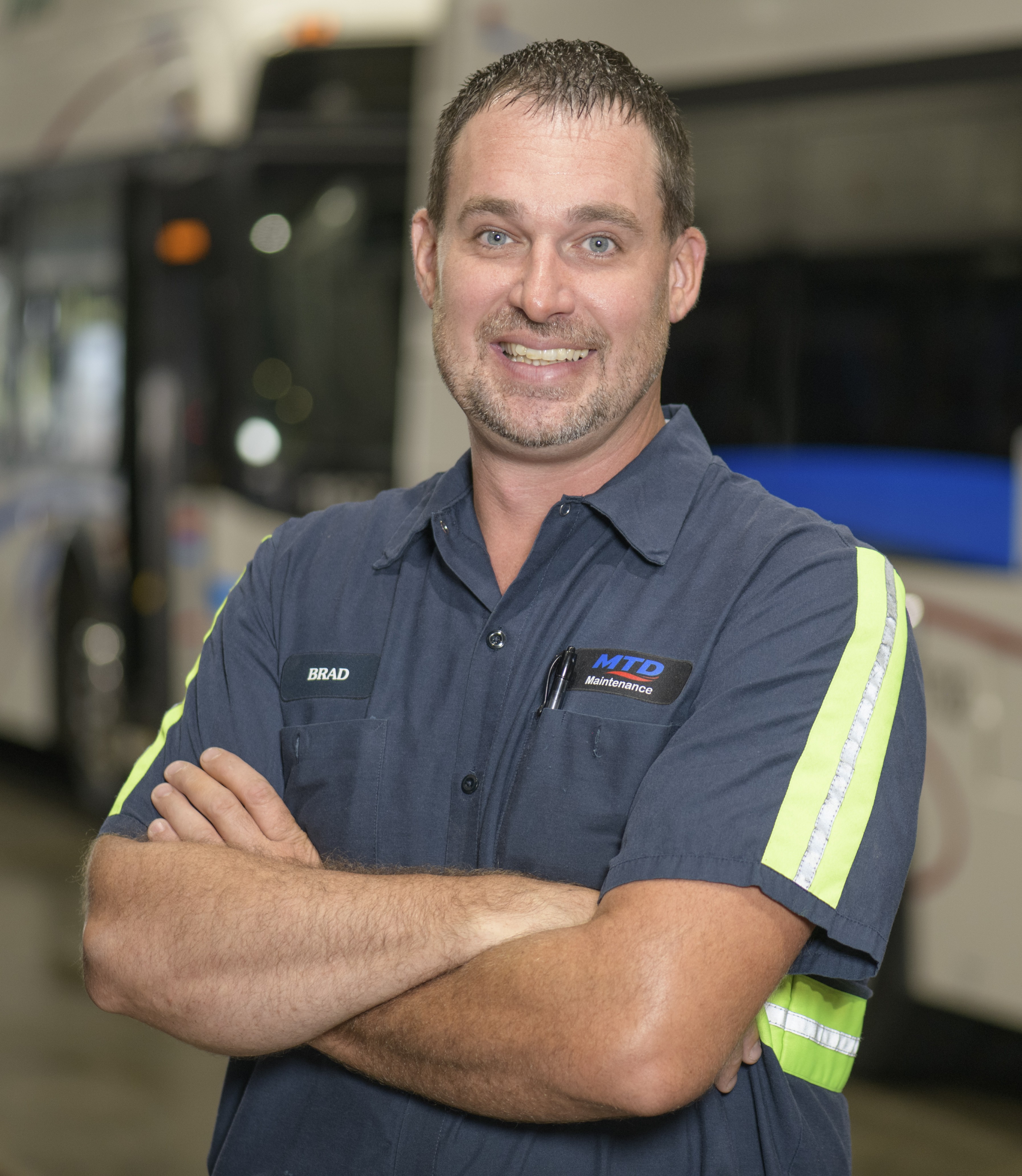Brad Witt in front of an MTD bus
