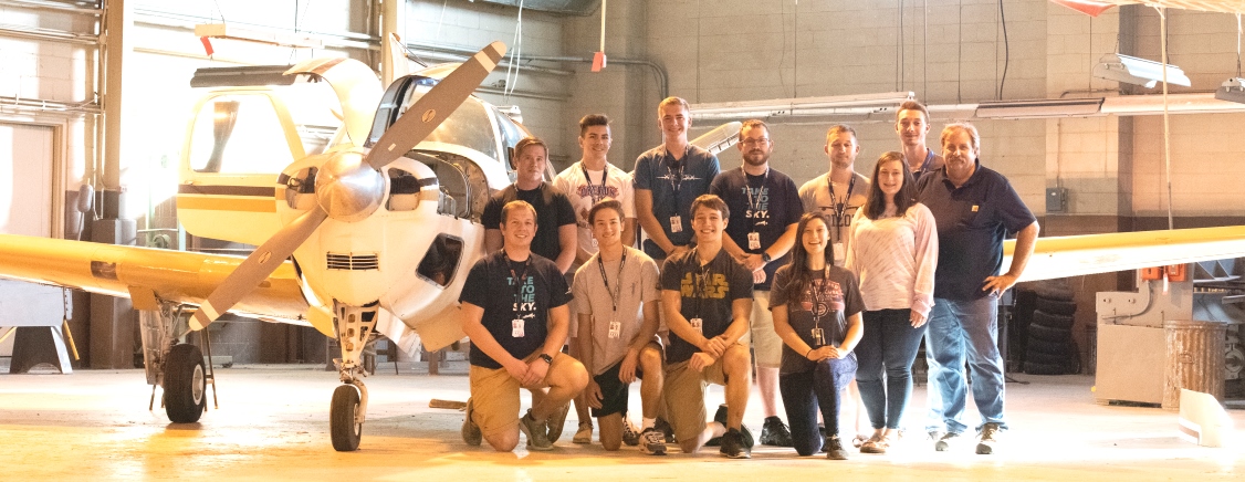 Students in front of Aviation Institute Plane