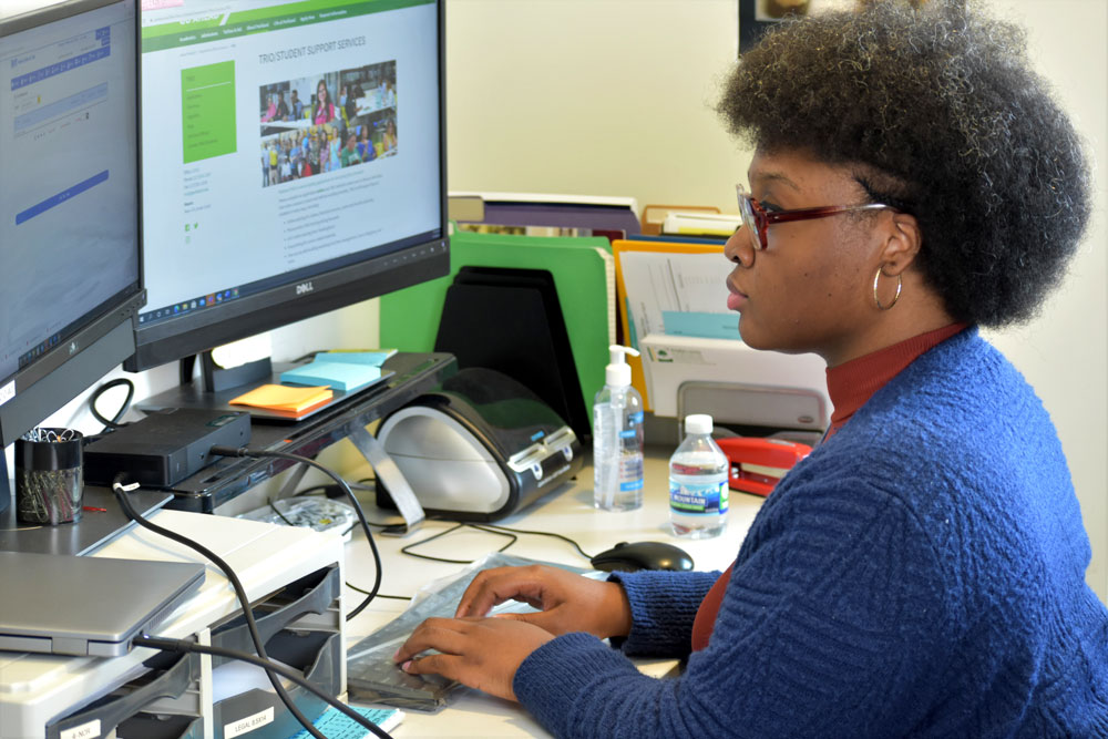 african american student typing on computer