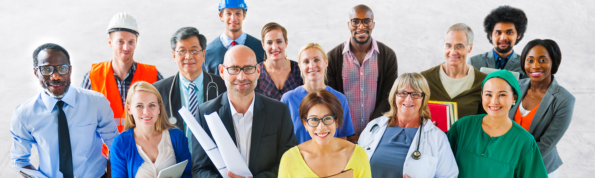 large group of adults dressed for various jobs