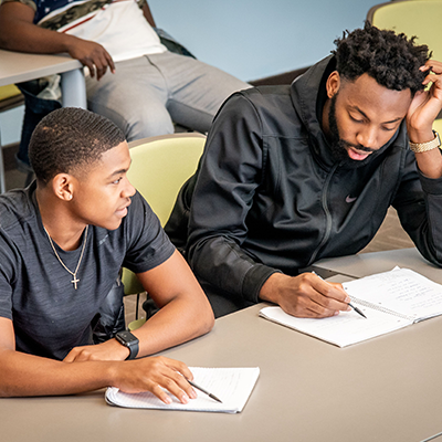 Two male students studying