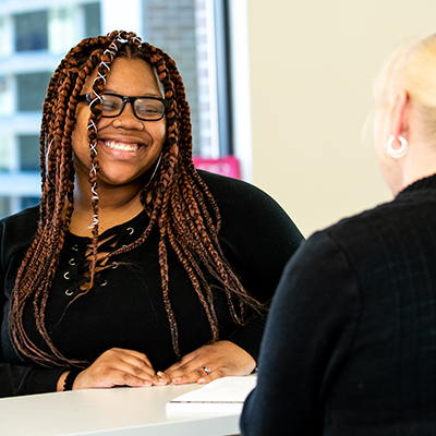 Female student speaking with advisor