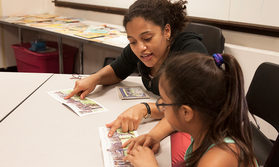Student teaching child