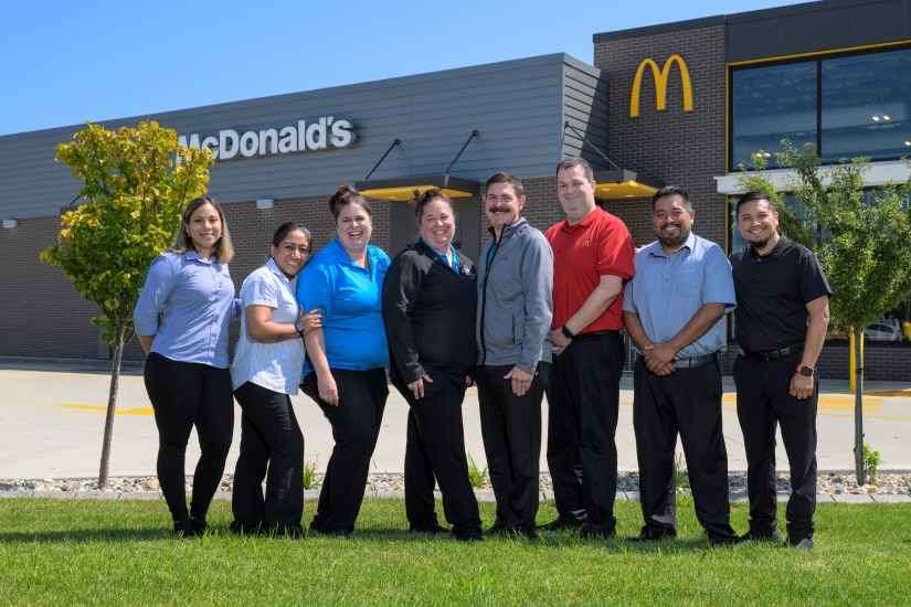 A group of Leading Edge participants standng in front of a McDonald's A group of Leading Edge participants standng in front of a McDonald's