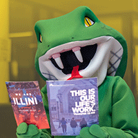 Coby mascot holding college brochures