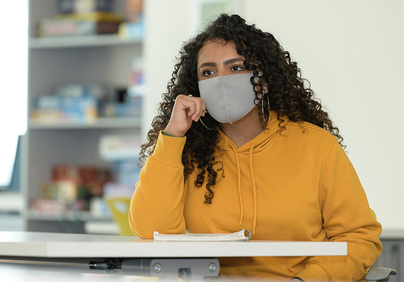 woman in class wearing mask